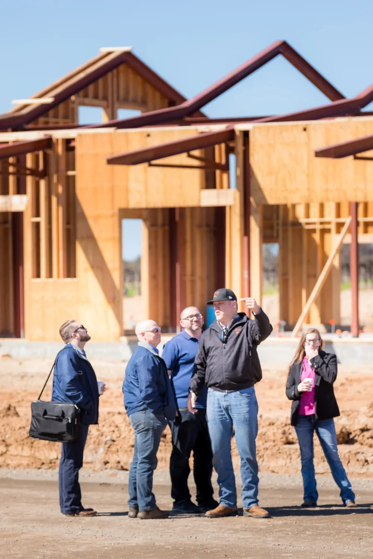 mccaffrey-team-in-front-of-new-construction-homes